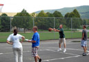 With ample supervision, Dad launches a foul shot  Rick Barry-style