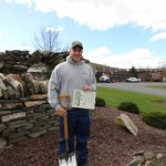 Jeremy L. Thorne, with his Silver Shovel award and certificate, outside Pennsylvania College of Technology's Schneebeli Earth Science Center