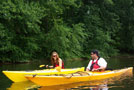 Resident Assistants Lee D. Michels and Melanie A. Roof converse shortly after getting their kayaks in the water