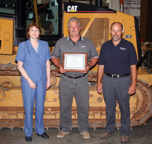 William P. Kilcoyne Jr., instructor of diesel equipment technology at Pennsylvania College of Technology, (holding award) is joined by Mary A. Sullivan, dean of natural resources management at the college%3B and Douglas C. Wetzel, Cleveland Brothers Equipment Co. Inc., chairman of the Caterpillar Excellence Fund. (Photo by Misty Kennard-Mayer, coordinator of matriculation and retention, School of Natural Resources Management)
