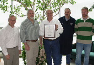 Members of Pennsylvania College of Technology's horticulture faculty, from left, are Carl J. Bower, instructor%3B assistant professors Dennis P. Skinner, Dennis Fink (holding reaccreditation plaque) and Michael A. Dincher%3B and Justin Shelinski, laboratory assistant. (Photo by Garrett M. Book, of Lebanon, an ornamental horticulture%3A landscape technology emphasis major.)