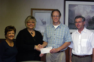 Debra M. Miller, director of corporate relations, Pennsylvania College of Technology%3B accepts a scholarship check from Rick Evans, president, Liberty Excavators Inc.%3B joined by Karen Hawkins, human resources, Liberty Excavators%3B and Lester Gouffer, the corporation's vice president.