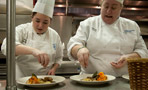 Team Heads' Katelyn R. Ciavardini and Aimee M. Stout add finishing touches to the entrée they call 'rabbit two ways'
