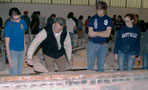 Along a line of bricks, students learn from Anthony V. Mirarchi, a field representative/apprentice director for the bricklayers' Harrisburg union local and a member of the college's Carpentry/Construction Technology Advisory Committee
