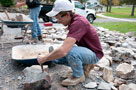 The mark of a skilled mason (represented here by student Travis M. Cain, of Bloomsburg) is the ability to read the stone and understand its composition, then to cut and shape it to fit into the puzzle
