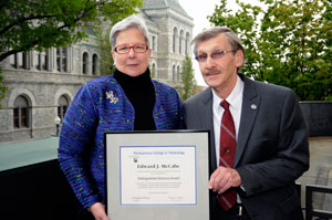 Edward J. McCabe is congratulated on his 2011 Distinguished Alumni Award by Pennsylvania College of Technology President Davie Jane Gilmour.