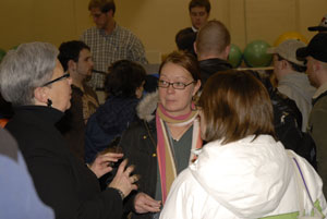 President Gilmour talks individually with students after Tuesday's meeting in Bardo Gymnasium.