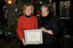 Sharon Koppel, left, executive director of Snyder Union Mifflin Child Development Inc., accepted a Mentorship Award presented by Pennsylvania College of Technology President Davie Jane Gilmour at the college%E2%80%99s Winter Commencement ceremony.