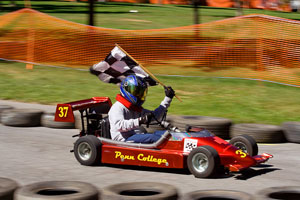 One of Penn College's entries in the Stock category waves the checkered flag.