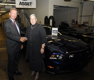 Pennsylvania College of Technology President Davie Jane Gilmour, in the college%E2%80%99s Ford ASSET lab with Jim Kelly, field service engineer for the Ford Motor Co.'s mid-Atlantic area, and a 2011 Ford Mustang recently delivered for instructional use.