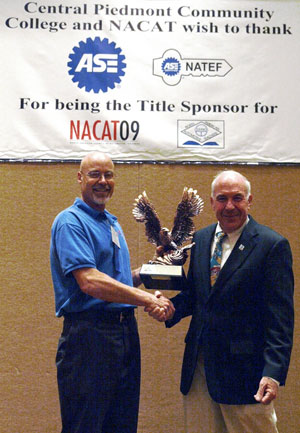 Dale E. Jaenke, assistant professor of automotive technology at Pennsylvania College of Technology (left), accepts award from Dan Perrin, executive manager of the North American Council of Automotive Teachers. (Photo provided by Central Piedmont Community College and NACAT)