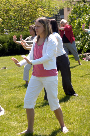 Occupational therapy assistant alumna Melissa A. Frederick (Class of 2007) joins others in a session showing participants how to use Tai Chi to help clients.
