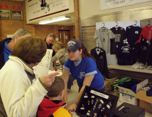 Lauren E. Luckenbaugh helps a customer at the souvenir stand.