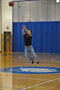 A contestant puts his all into a half-court attempt
