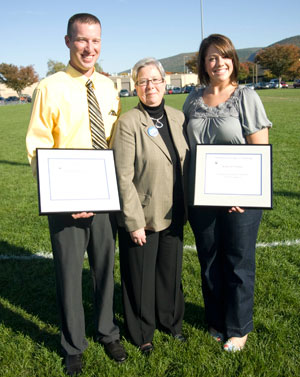 Outstanding Varsity Athletic Alumni Award-winners Chad L. Karstetter and Katlyn D. Stupar join Pennsylvania College of Technology President Davie Jane Gilmour (center) during Homecoming 2008 activities on Oct. 11. (Photo by Kenneth T. Barto, student photographer)