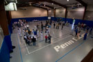 Party With the Wildcats attendees move among numerous activities on the Field House floor