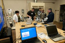 Gary E. McQuay, PMC project manager (far right), oversees a hands-on exercise