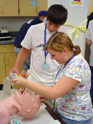 Participants in the 2007 camp intubate a mock patient in Pennsylvania College of Technology's paramedic lab.