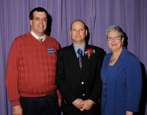 Patrick Breen, center, with nominator Matthew Branca and President Gilmour.