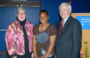 Loyalsock Township High School senior Niesha J. Williams, center, receives congratulations from Pennsylvania College of Technology President Davie Jane Gilmour and state Sen. Gene Yaw on receiving the Peggy Madigan Memorial Leadership Scholarship.
