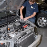 Wearing the Clearfield County CTC logo, Morgan T. Reader, of Houtzdale, assembles a fender