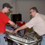 SUN Area's Justin C. Wise, Mount Pleasant Mills, gets a hand from instructor Roy H. Klinger during disassembly/reassembly of an automobile door