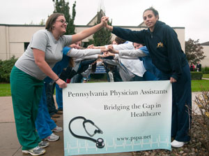 Pennsylvania College of Technology physician assistant students form a %E2%80%9Chuman bridge%E2%80%9D to demonstrate the Pennsylvania-wide Physician Assistant Day theme, %E2%80%9CBridging the Gap in Healthcare.%E2%80%9D