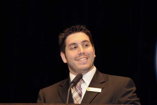 J. Piccari, recipient of an Alumni Achievement Award during Penn College commencement, is greeted by President Davie Jane Gilmour.