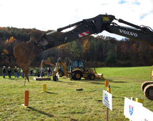 An array of heavy construction equipment is put through a variety of skill events %E2%80%93 including a %E2%80%9CPipe Pick%E2%80%9D using an excavator, in foreground %E2%80%93 during a %E2%80%9Crodeo%E2%80%9D held during Pennsylvania College of Technology%E2%80%99s recent Fall Open House.