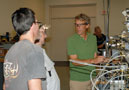 John M. Good, right, instructs students on the application of industrial pneumatic components