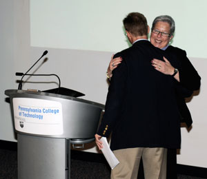Pennsylvania College of Technology President Davie Jane Gilmour embraces Douglas T. Byerly during his introduction to the college community Wednesday.