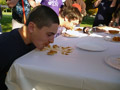 Digging in during the pumpkin pie-eating contest are Phi Mu Delta's Clifford Nanfeldt (foreground) and Ryan M. Enders from Sigma Nu