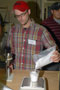 Justin Cart, of Akro Plastics in Kent, Ohio, measures 100 grams of powder during a materials-preparation lab