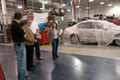 Colin W. Williamson, dean of transportation technology, tells a group of educators about the partnerships Penn College has made with automotive museums to create a new automotive restoration technology major