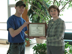 Andrew C. Reisinger officially receives his mikeroweWORKS Foundation tool scholarship from Mary A. Sullivan, dean of natural resources management. (Photo by Deborah C. Books, secretary to the dean of natural resources management)
