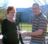 Peggy A. Barbour accepts 'Relay' check from Jeremy S. Frost