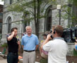 Rob Steele, executive director of the Community Arts Center, is interviewed by Ryan Leckey outside City Hall