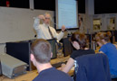 Holding a routing cable, Jeff B. Weaver, associate professor of electronics and computer engineering technology, connects with his audience