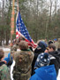 Boy Scouts raise the colors over their campsite
