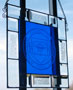 A stained-glass version of the college seal, created by Keith M. Whitesel, instructor of electrical technology/occupations, and donated by SGA, catches sunlight outside the Bush Campus Center 