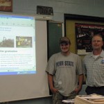 Penn College forest technology student Dustin S. Beane reunites with former teacher Jack Detrick at Kane High School