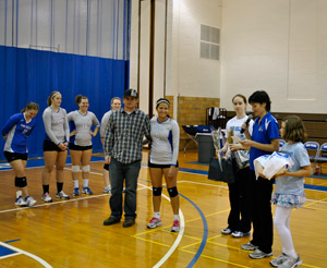 Volleyball coach Bambi Hawkins reminisces about Paula Karine Monteiro during midcourt 'Senior Day' honors