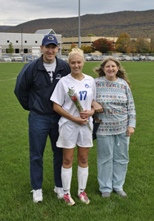 Soccer senior Lauren Hammer poses with her parents