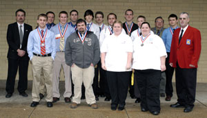 Members of Pennsylvania College of Technology's medal-winning SkillsUSA team gather with faculty advisers upon their return to campus from state competition in Hershey.