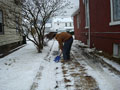 Pittsburgh's Joshua M. Dentel works his way through the wet, heavy snow