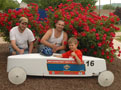 Offering a confident thumbs-up for race day are driver Jonathan Ohl, with Ben Rinker (left) and Dan Donella, the first of the participants to complete construction