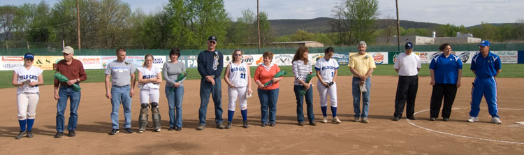 Graduating members of the Lady Wildcat softball team take to the infield Wednesday for a Senior Day tribute with their families and coaches. From left are Lisa Miller (10), Samantha Mills (7), Heather Ball (21) and Jamye Mease (11).