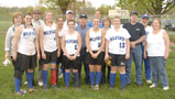 Softball seniors gather with parents near the Athletic Field