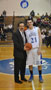 Greg Solyak is congratulated by Wildcat basketball coach Gene Bruno