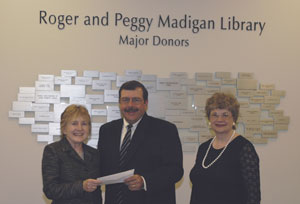 From left, Lisette N. Ormsbee, director of the Madigan Library%3B Paul H. Rooney, senior vice president%2Fregional president for Sovereign Bank%3B and Marilyn G. Bodnar, librarian, instructional initiatives, business and law.